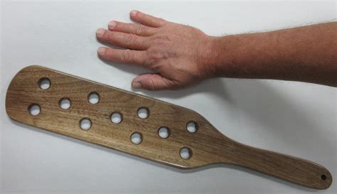 wooden paddle with holes